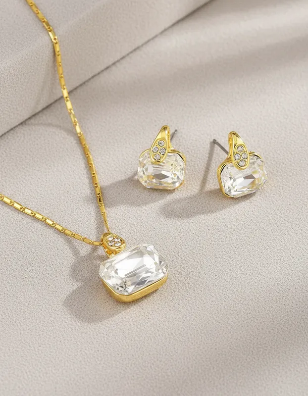 Set Luz Eterna Collar y Aretes en Baño de Oro con Cristal Blanco Rectangular Veramorest